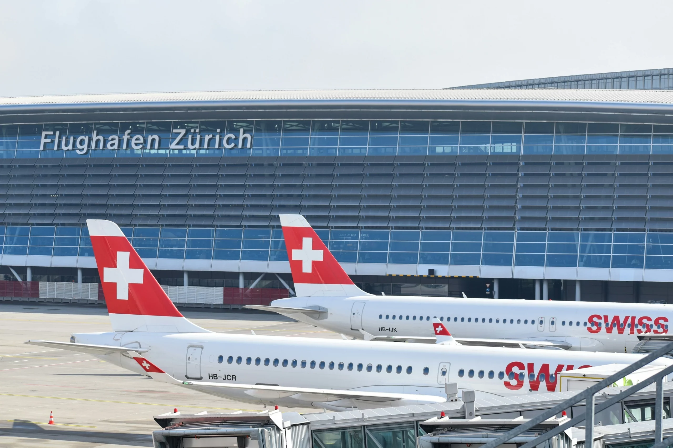 Airplanes parked at gates at Zurich International Airport