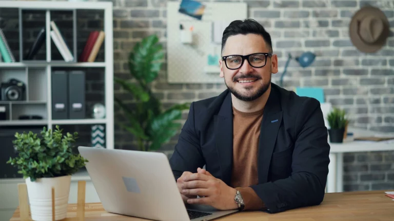 Man sitting at a desk with open notebook