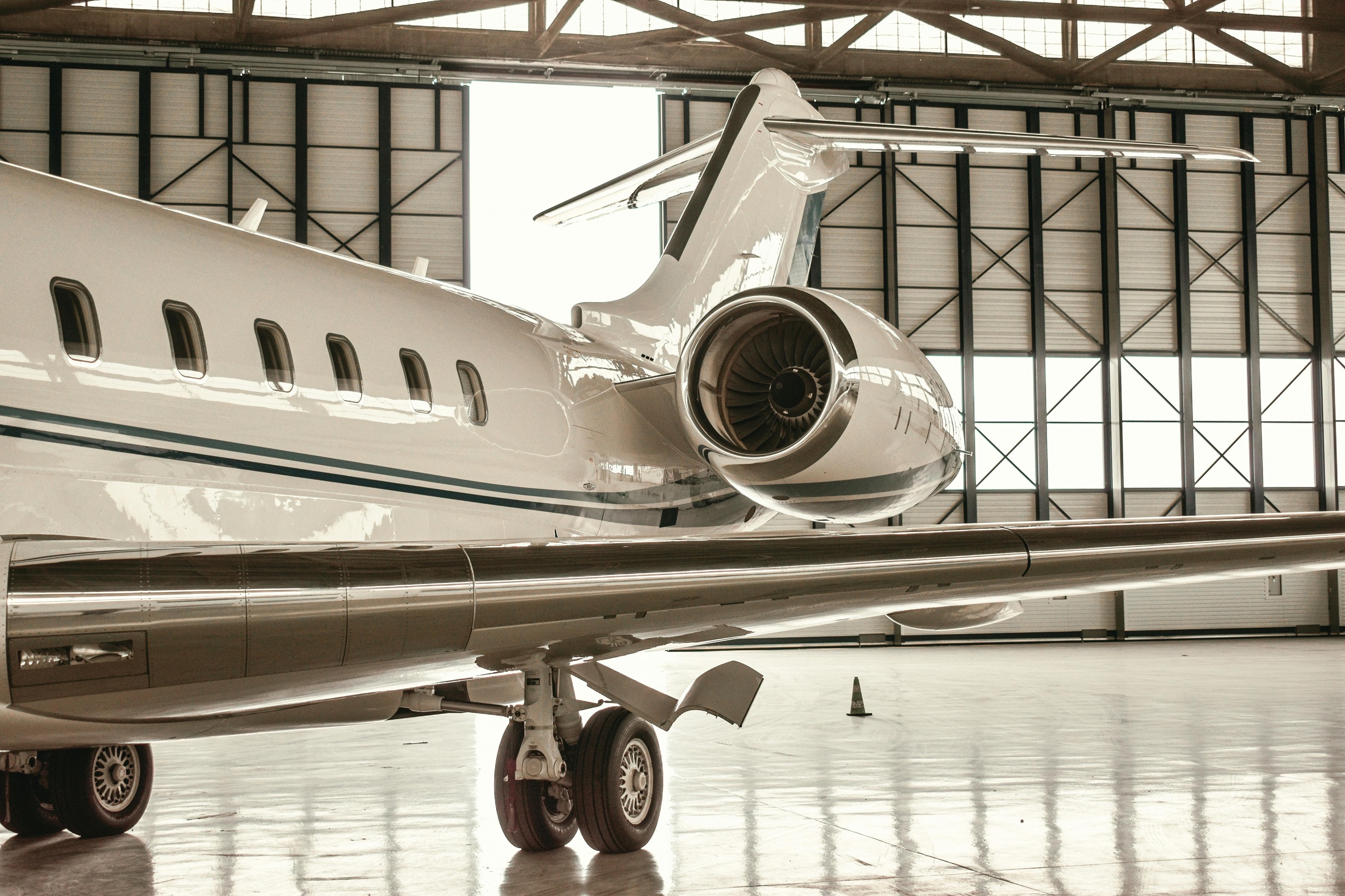 Private jet parked in a hangar