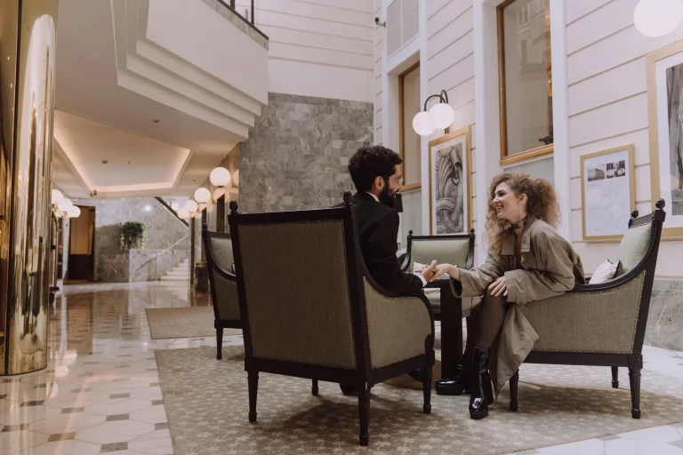 Man and woman meeting in a hotel lobby