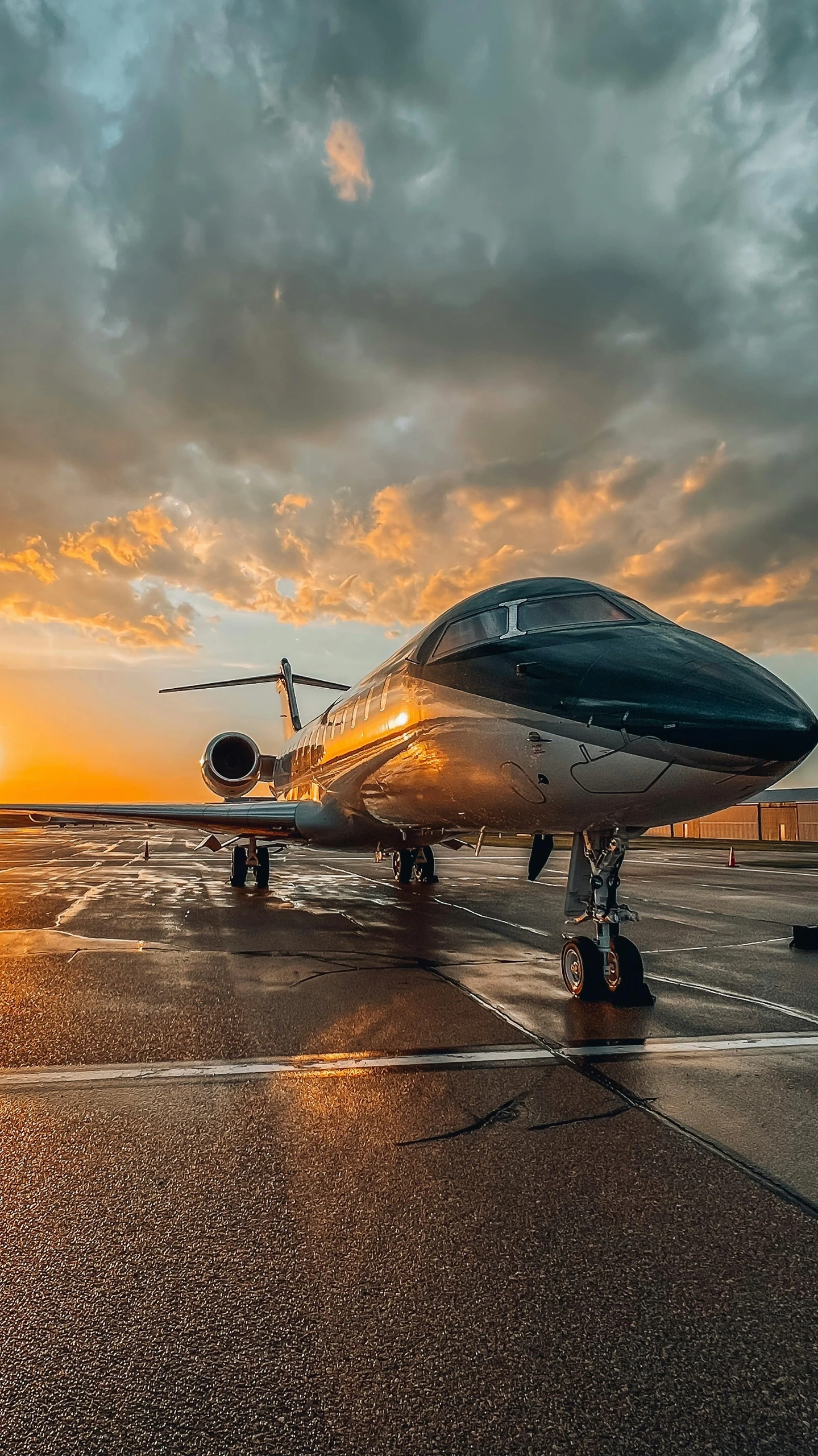 Private jet on tarmac at sunset