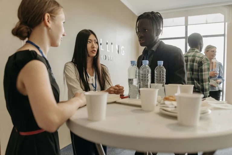 Colleagues standing at a table