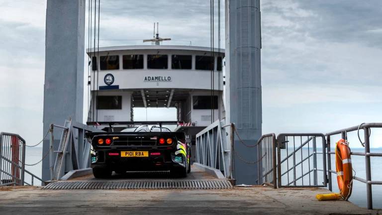 Sportscar entering ferry in Italy