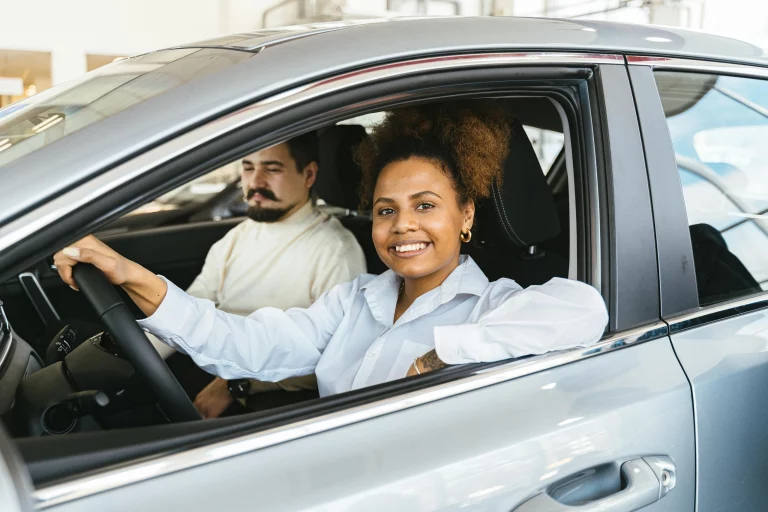 Woman and man in a rental car